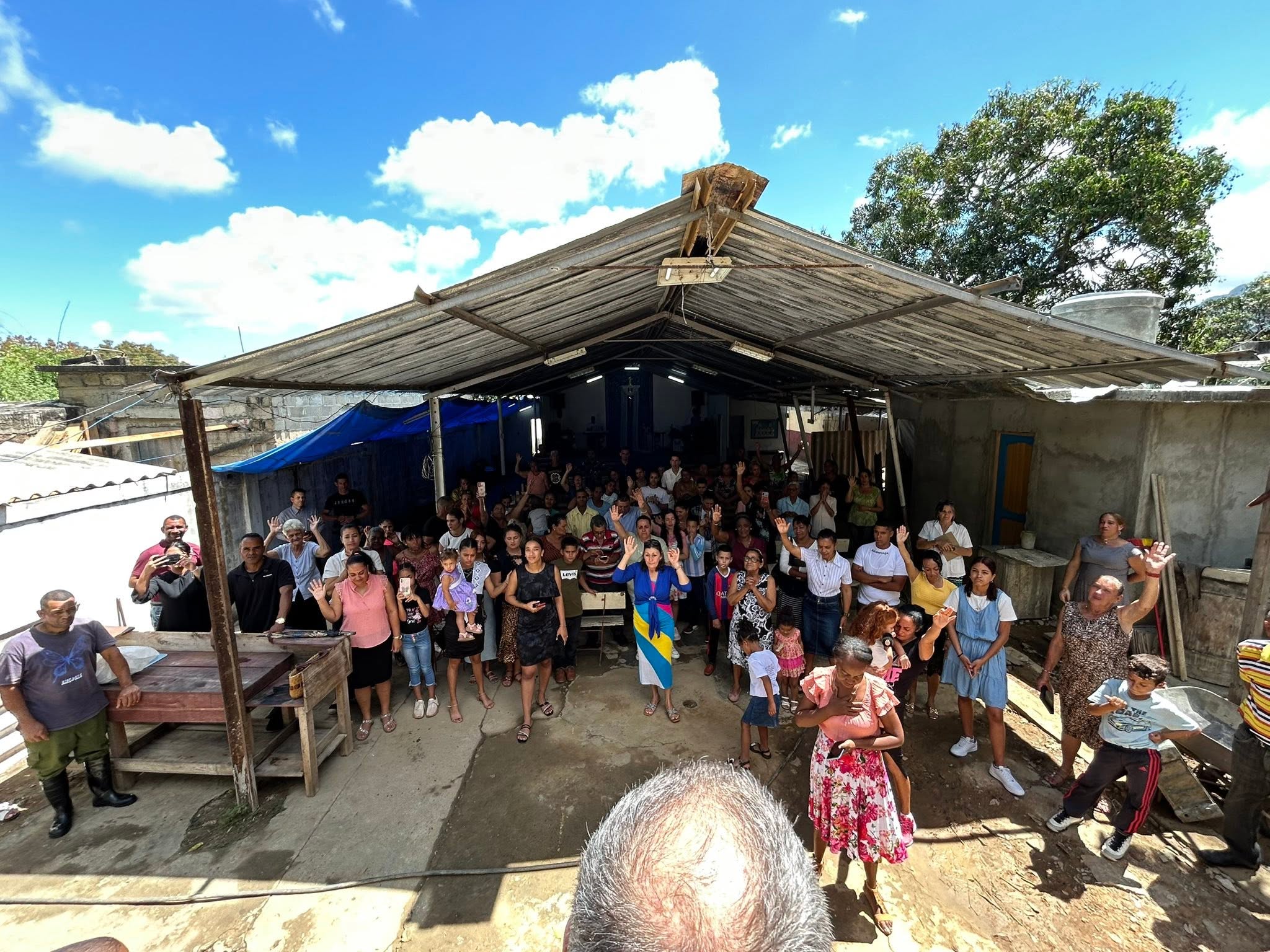Worshiping under a tent at a local church in Cuba