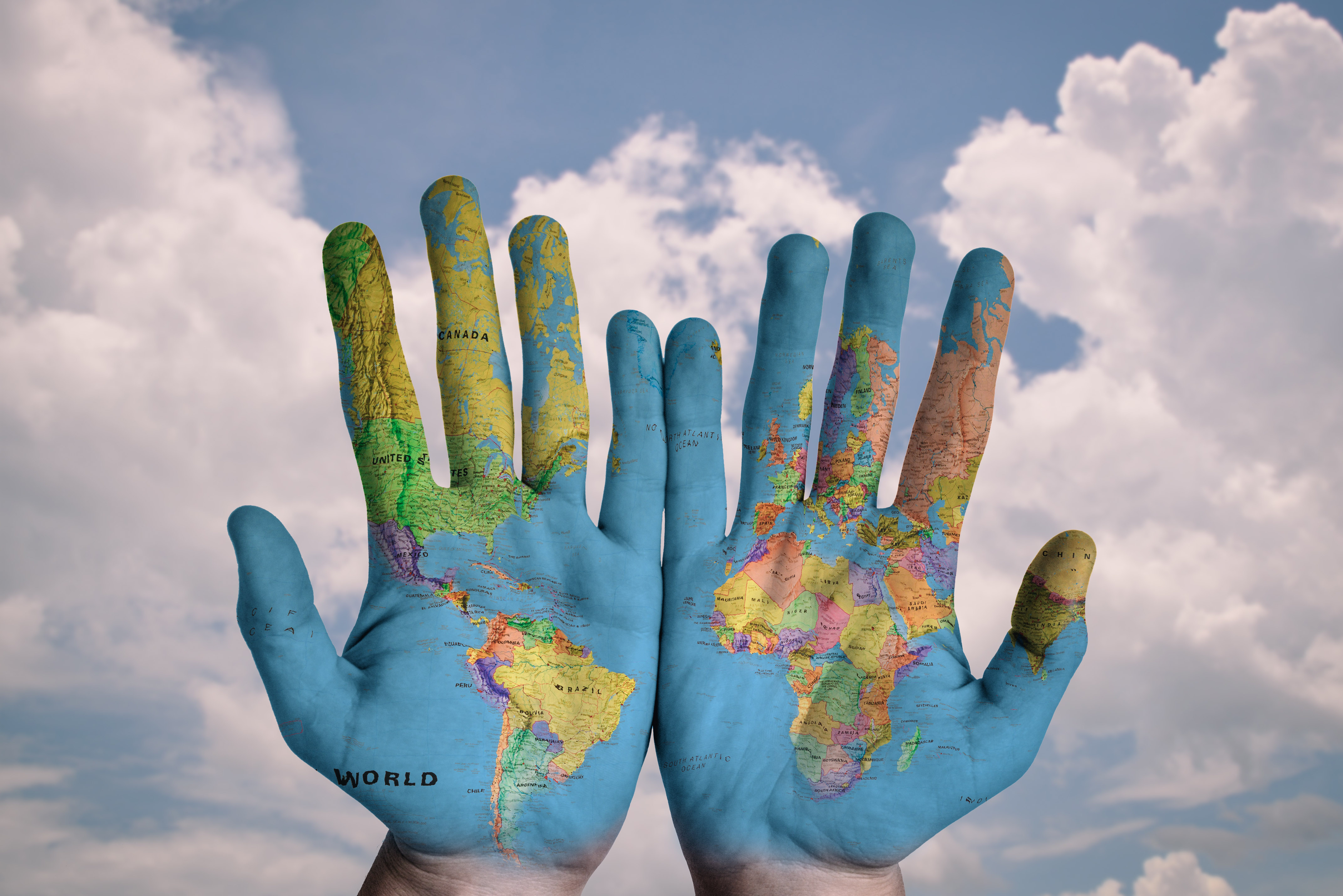 Hands painted ad a globe