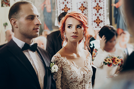 Woman looking at husband at wedding