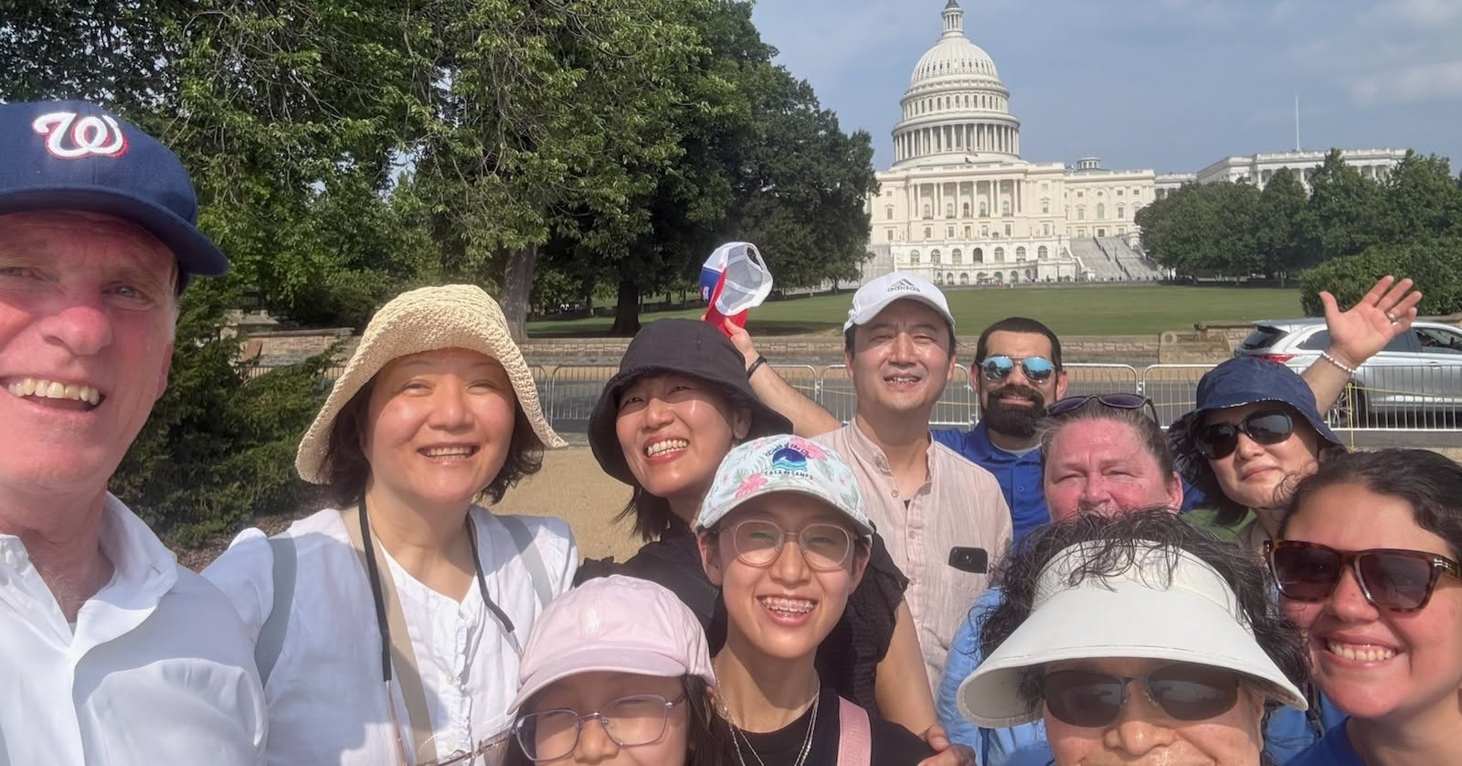 group posing in front of capitol building