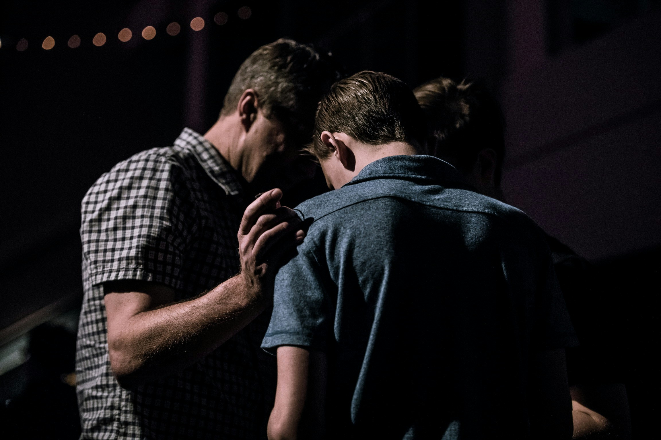Men praying together